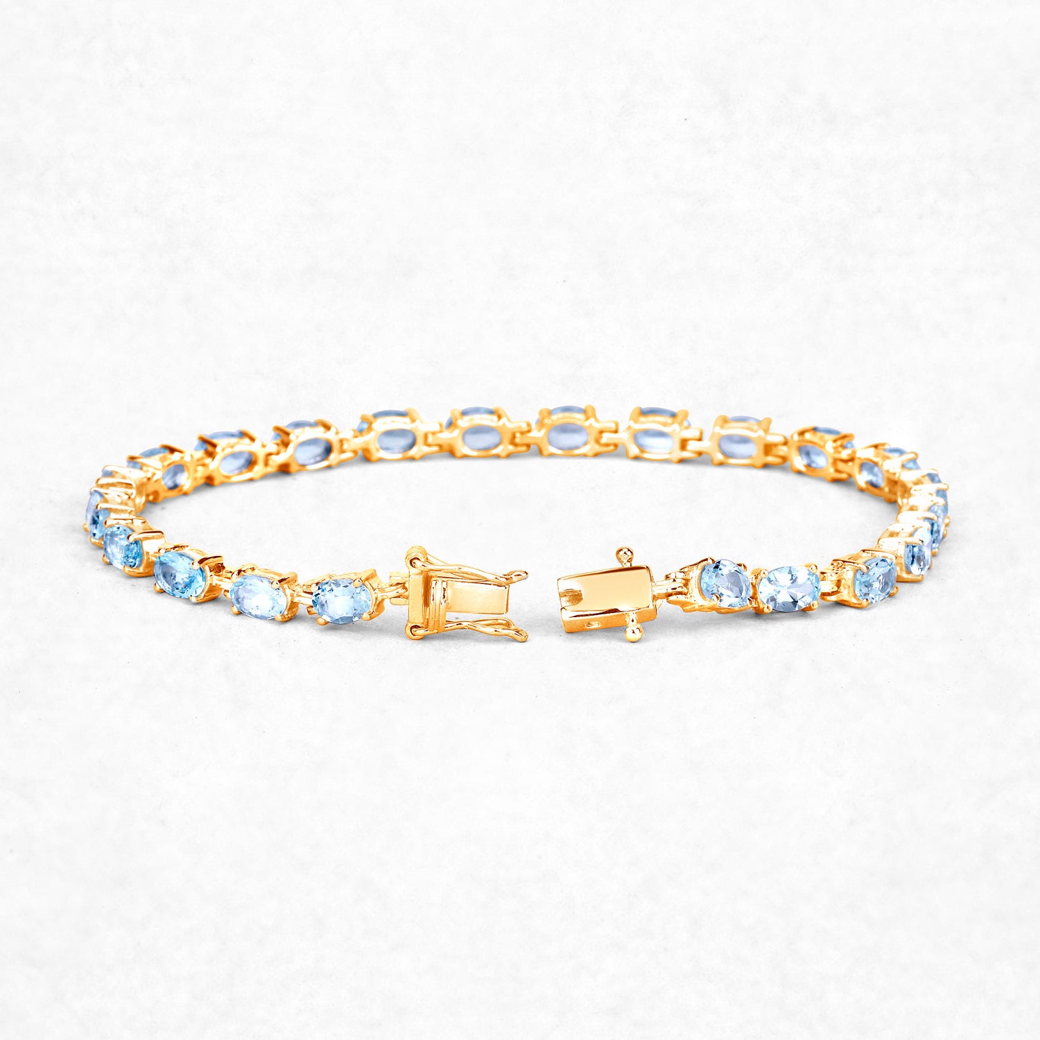 Blue Topaz Tennis Bracelet 11.2 Carats Gold Plated Silver